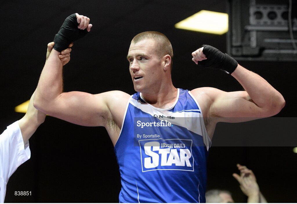 1 March 2014 ; Dean Gardiner, Clonmel Boxing Club, celebrates as he is declared the winner over Joe Joyce, Moate, Boxing Club, following their 91+ kg bout. National Senior Boxing Championships Semi Finals, National Stadium, Dublin. Photo by Sportsfile