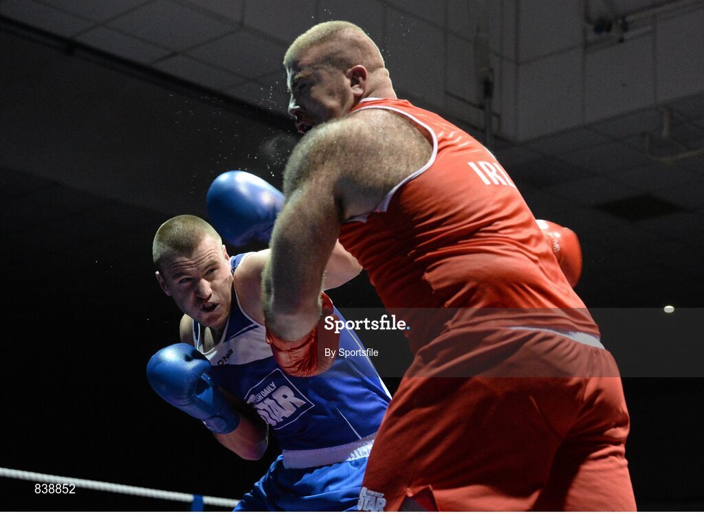 1 March 2014; Dean Gardiner, left, Clonmel Boxing Club, exchanges punches with Joe Joyce, Moate Boxing Club, during their 91+ kg bout. National Senior Boxing Championships Semi Finals, National Stadium, Dublin. Photo by Sportsfile
