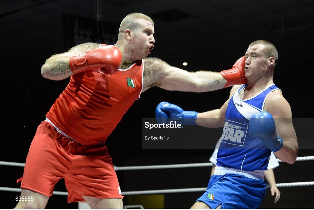 1 March 2014; Joe Joyce, left, Moate Boxing Club, exchanges punches with Dean Gardiner, Clonmel Boxing Club, during their 91+ kg bout. National Senior Boxing Championships Semi Finals, National Stadium, Dublin. Photo by Sportsfile