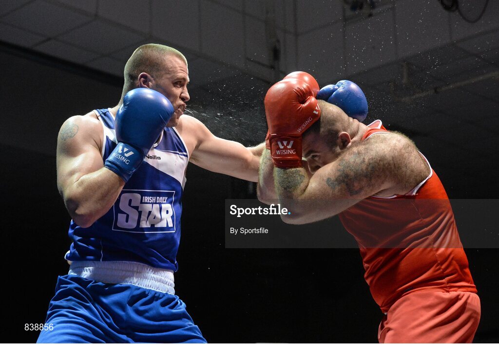 1 March 2014; Dean Gardiner, left, Clonmel Boxing Club, exchanges punches with Joe Joyce, Moate Boxing Club, during their 91+ kg bout. National Senior Boxing Championships Semi Finals, National Stadium, Dublin. Photo by Sportsfile