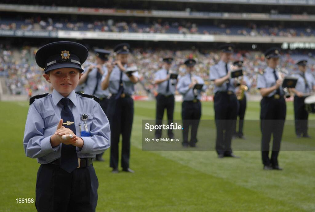 28 August 2005; Seven year old David Moran, Swinford, Co. Mayo, leads the Garda band on the pitch. David who suffers from luekaemia was made a honourary member of the Gardai for a week. Bank of Ireland All-Ireland Senior Football Championship Semi-Final, Kerry v Cork, Croke Park, Dublin. Picture credit; Ray McManus / SPORTSFILE