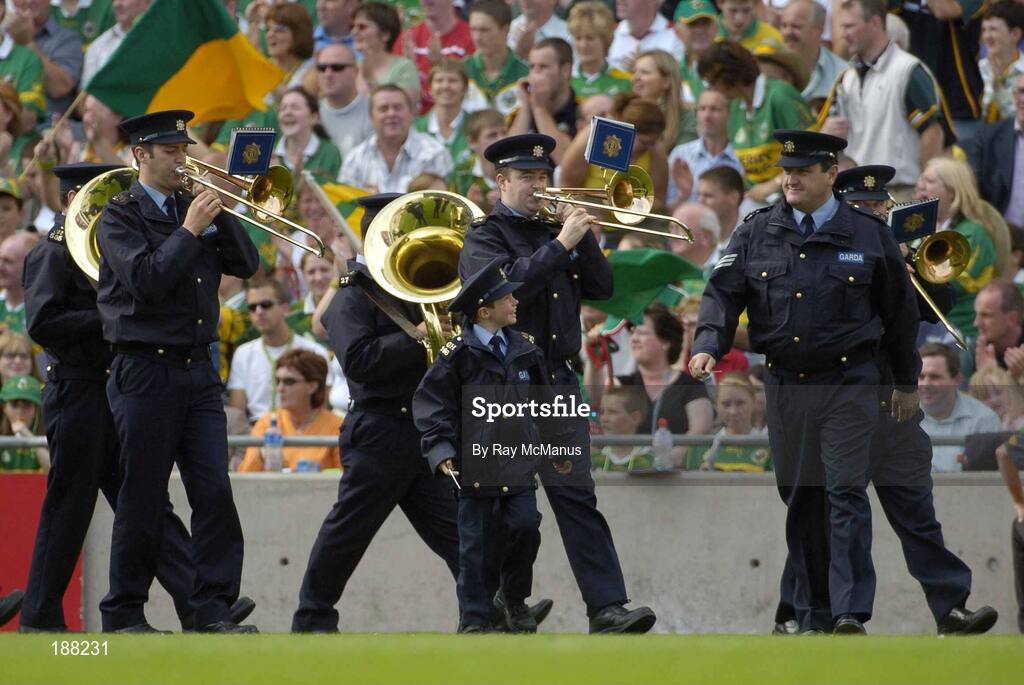 28 August 2005; Seven year old David Moran, Swinford, Co. Mayo, along side Sergeant Pat Kenny, as he leads the Garda band. David who suffers from luekaemia was made a honourary member of the Garda for a week . Bank of Ireland All-Ireland Senior Football Championship Semi-Final, Kerry v Cork, Croke Park, Dublin. Picture credit; Ray McManus / SPORTSFILE