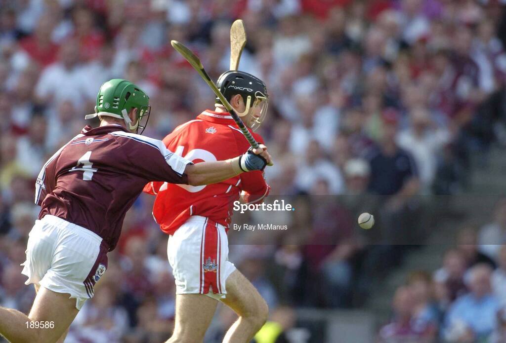 11 September 2005; Ben O' Connor, Cork, scores a goal despite the best efforts of Galway's Ollie Canning. Guinness All-Ireland Senior Hurling Championship Final, Galway v Cork, Croke Park, Dublin. Picture credit; Ray McManus / SPORTSFILE *** Local Caption *** Any photograph taken by SPORTSFILE during, or in connection with, the 2005 Guinness All-Ireland Hurling Final which displays GAA logos or contains an image or part of an image of any GAA intellectual property, or, which contains images of a GAA player/players in their playing uniforms, may only be used for editorial and non-advertising purposes.  Use of photographs for advertising, as posters or for purchase separately is strictly prohibited unless prior written approval has been obtained from the Gaelic Athletic Association.