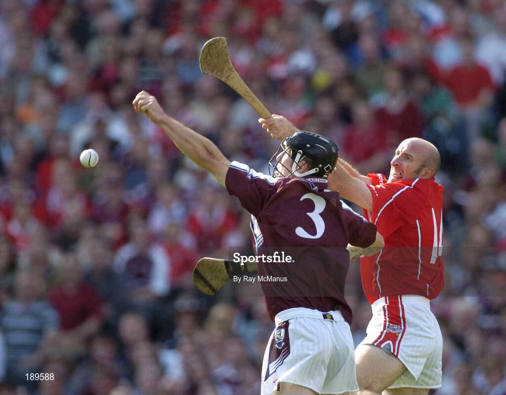 11 September 2005; Brian Corcoran, Cork, in action against Tony Og Regan, Galway. Guinness All-Ireland Senior Hurling Championship Final, Galway v Cork, Croke Park, Dublin. Picture credit; Ray McManus / SPORTSFILE *** Local Caption *** Any photograph taken by SPORTSFILE during, or in connection with, the 2005 Guinness All-Ireland Hurling Final which displays GAA logos or contains an image or part of an image of any GAA intellectual property, or, which contains images of a GAA player/players in their playing uniforms, may only be used for editorial and non-advertising purposes.  Use of photographs for advertising, as posters or for purchase separately is strictly prohibited unless prior written approval has been obtained from the Gaelic Athletic Association.