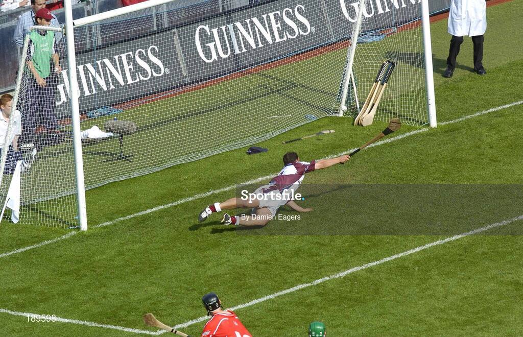 11 September 2005; Cork's Ben O'Connor shoots past Galway goalkeeper Liam Donoghue to score his sides opening goal. Guinness All-Ireland Senior Hurling Championship Final, Galway v Cork, Croke Park, Dublin. Picture credit; Damien Eagers / SPORTSFILE *** Local Caption *** Any photograph taken by SPORTSFILE during, or in connection with, the 2005 Guinness All-Ireland Hurling Final which displays GAA logos or contains an image or part of an image of any GAA intellectual property, or, which contains images of a GAA player/players in their playing uniforms, may only be used for editorial and non-advertising purposes.  Use of photographs for advertising, as posters or for purchase separately is strictly prohibited unless prior written approval has been obtained from the Gaelic Athletic Association.