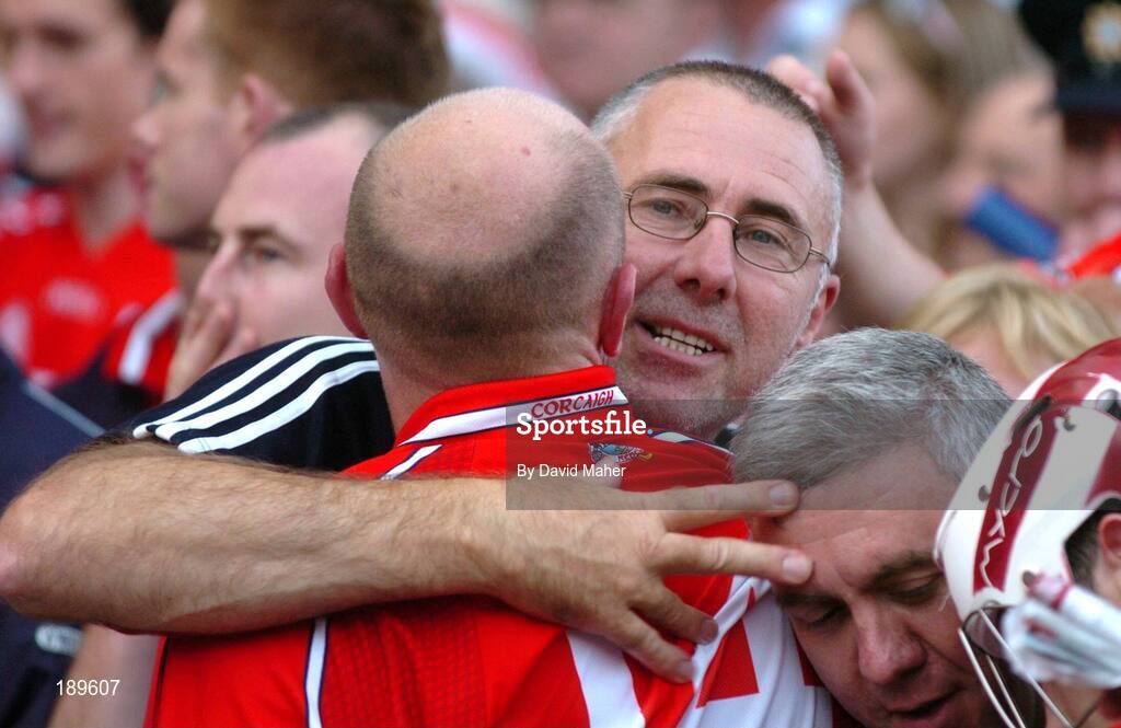 11 September 2005; Cork manager John Allen celebrates at the end of the game with Brian Corcoran. Guinness All-Ireland Senior Hurling Championship Final, Galway v Cork, Croke Park, Dublin. Picture credit; David Maher / SPORTSFILE *** Local Caption *** Any photograph taken by SPORTSFILE during, or in connection with, the 2005 Guinness All-Ireland Hurling Final which displays GAA logos or contains an image or part of an image of any GAA intellectual property, or, which contains images of a GAA player/players in their playing uniforms, may only be used for editorial and non-advertising purposes.  Use of photographs for advertising, as posters or for purchase separately is strictly prohibited unless prior written approval has been obtained from the Gaelic Athletic Association.