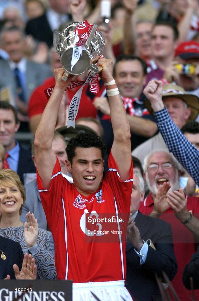 11 September 2005; The Cork captain Sean Og O hAilpin lifts the Liam MacCarthy Cup. Guinness All-Ireland Senior Hurling Championship Final, Galway v Cork, Croke Park, Dublin. Picture credit; Brendan Moran / SPORTSFILE *** Local Caption *** Any photograph taken by SPORTSFILE during, or in connection with, the 2005 Guinness All-Ireland Hurling Final which displays GAA logos or contains an image or part of an image of any GAA intellectual property, or, which contains images of a GAA player/players in their playing uniforms, may only be used for editorial and non-advertising purposes.  Use of photographs for advertising, as posters or for purchase separately is strictly prohibited unless prior written approval has been obtained from the Gaelic Athletic Association.
