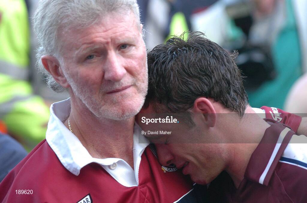 11 September 2005; A dejected Alan Kerins, Galway, is conforted by Sean Silke, Galway coaching staff, at the end of the game. Guinness All-Ireland Senior Hurling Championship Final, Galway v Cork, Croke Park, Dublin. Picture credit; David Maher / SPORTSFILE *** Local Caption *** Any photograph taken by SPORTSFILE during, or in connection with, the 2005 Guinness All-Ireland Hurling Final which displays GAA logos or contains an image or part of an image of any GAA intellectual property, or, which contains images of a GAA player/players in their playing uniforms, may only be used for editorial and non-advertising purposes.  Use of photographs for advertising, as posters or for purchase separately is strictly prohibited unless prior written approval has been obtained from the Gaelic Athletic Association.