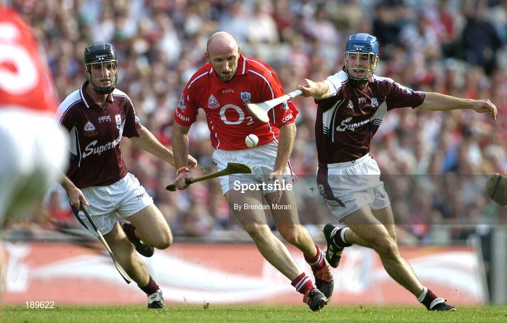 11 September 2005; Brian Corcoran, Cork, in action against Shane Kavanagh, left, and David Collins, Galway. Guinness All-Ireland Senior Hurling Championship Final, Galway v Cork, Croke Park, Dublin. Picture credit; Brendan Moran / SPORTSFILE *** Local Caption *** Any photograph taken by SPORTSFILE during, or in connection with, the 2005 Guinness All-Ireland Hurling Final which displays GAA logos or contains an image or part of an image of any GAA intellectual property, or, which contains images of a GAA player/players in their playing uniforms, may only be used for editorial and non-advertising purposes.  Use of photographs for advertising, as posters or for purchase separately is strictly prohibited unless prior written approval has been obtained from the Gaelic Athletic Association.