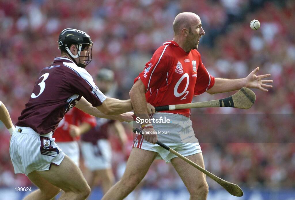 11 September 2005; Brian Corcoran, Cork, in action against Tony Og Regan, Galway. Guinness All-Ireland Senior Hurling Championship Final, Galway v Cork, Croke Park, Dublin. Picture credit; Brendan Moran / SPORTSFILE *** Local Caption *** Any photograph taken by SPORTSFILE during, or in connection with, the 2005 Guinness All-Ireland Hurling Final which displays GAA logos or contains an image or part of an image of any GAA intellectual property, or, which contains images of a GAA player/players in their playing uniforms, may only be used for editorial and non-advertising purposes.  Use of photographs for advertising, as posters or for purchase separately is strictly prohibited unless prior written approval has been obtained from the Gaelic Athletic Association.