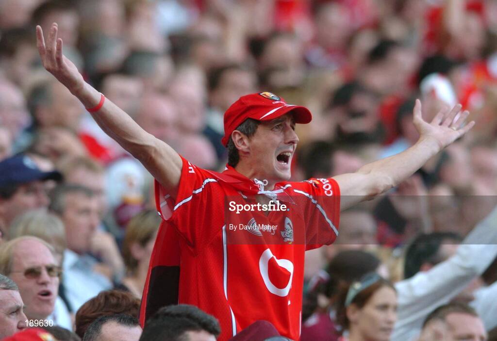 11 September 2005; A Cork supporter cheers on his team during the game. Guinness All-Ireland Senior Hurling Championship Final, Galway v Cork, Croke Park, Dublin. Picture credit; David Maher / SPORTSFILE *** Local Caption *** Any photograph taken by SPORTSFILE during, or in connection with, the 2005 Guinness All-Ireland Hurling Final which displays GAA logos or contains an image or part of an image of any GAA intellectual property, or, which contains images of a GAA player/players in their playing uniforms, may only be used for editorial and non-advertising purposes.  Use of photographs for advertising, as posters or for purchase separately is strictly prohibited unless prior written approval has been obtained from the Gaelic Athletic Association.