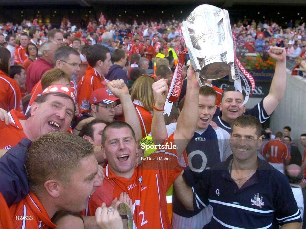 11 September 2005; Diarmuid O'Sullivan, centre, Cork, celebrates at the end of the game with supporters. Guinness All-Ireland Senior Hurling Championship Final, Galway v Cork, Croke Park, Dublin. Picture credit; David Maher / SPORTSFILE *** Local Caption *** Any photograph taken by SPORTSFILE during, or in connection with, the 2005 Guinness All-Ireland Hurling Final which displays GAA logos or contains an image or part of an image of any GAA intellectual property, or, which contains images of a GAA player/players in their playing uniforms, may only be used for editorial and non-advertising purposes.  Use of photographs for advertising, as posters or for purchase separately is strictly prohibited unless prior written approval has been obtained from the Gaelic Athletic Association.