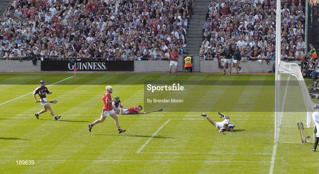 11 September 2005; Galway goalkeeper Liam Donoghue fails to stop a shot by Cork's Ben O'Connor, on ground, for Cork's only goal. Guinness All-Ireland Senior Hurling Championship Final, Galway v Cork, Croke Park, Dublin. Picture credit; Brendan Moran / SPORTSFILE *** Local Caption *** Any photograph taken by SPORTSFILE during, or in connection with, the 2005 Guinness All-Ireland Hurling Final which displays GAA logos or contains an image or part of an image of any GAA intellectual property, or, which contains images of a GAA player/players in their playing uniforms, may only be used for editorial and non-advertising purposes.  Use of photographs for advertising, as posters or for purchase separately is strictly prohibited unless prior written approval has been obtained from the Gaelic Athletic Association.