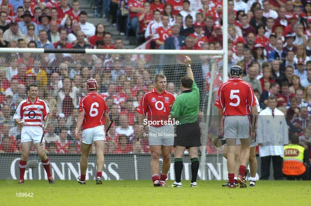 11 September 2005; Diarmuid O'Sullivan, Cork, is shown the yellow card by referee Seamus Roche. Guinness All-Ireland Senior Hurling Championship Final, Galway v Cork, Croke Park, Dublin. Picture credit; Ray McManus / SPORTSFILE *** Local Caption *** Any photograph taken by SPORTSFILE during, or in connection with, the 2005 Guinness All-Ireland Hurling Final which displays GAA logos or contains an image or part of an image of any GAA intellectual property, or, which contains images of a GAA player/players in their playing uniforms, may only be used for editorial and non-advertising purposes.  Use of photographs for advertising, as posters or for purchase separately is strictly prohibited unless prior written approval has been obtained from the Gaelic Athletic Association.
