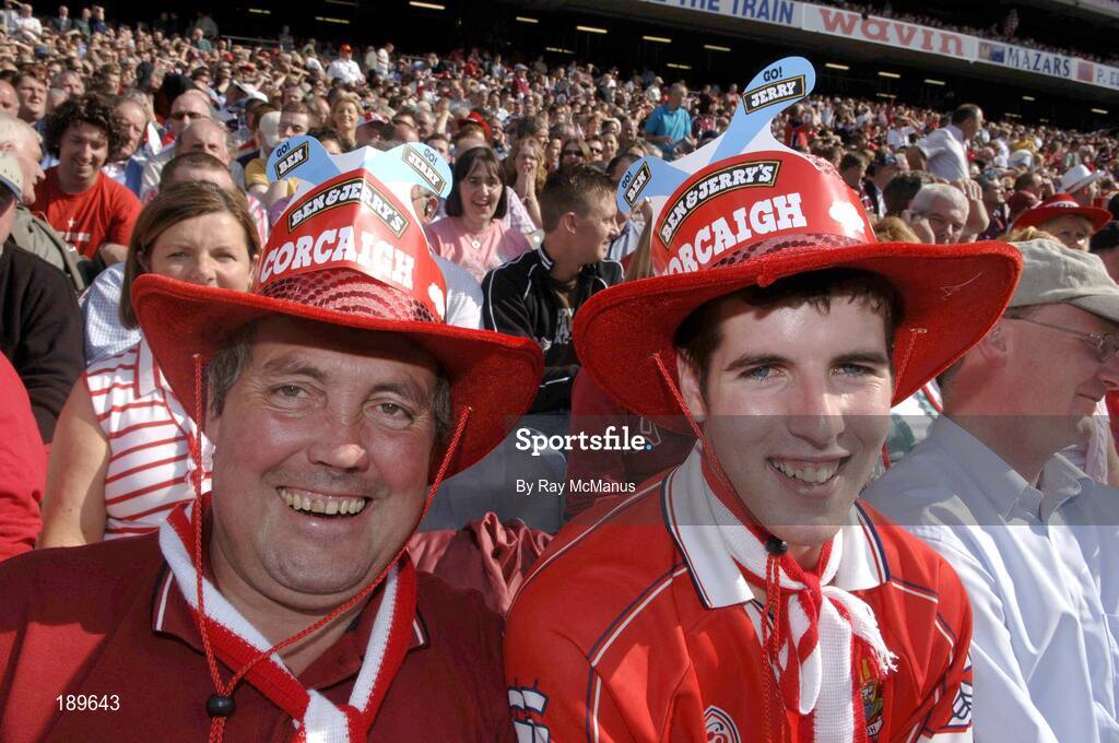 11 September 2005; Two Cork supporters await the start of the game. Guinness All-Ireland Senior Hurling Championship Final, Galway v Cork, Croke Park, Dublin. Picture credit; Ray McManus / SPORTSFILE *** Local Caption *** Any photograph taken by SPORTSFILE during, or in connection with, the 2005 Guinness All-Ireland Hurling Final which displays GAA logos or contains an image or part of an image of any GAA intellectual property, or, which contains images of a GAA player/players in their playing uniforms, may only be used for editorial and non-advertising purposes.  Use of photographs for advertising, as posters or for purchase separately is strictly prohibited unless prior written approval has been obtained from the Gaelic Athletic Association.