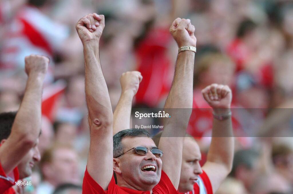 11 September 2005; A Cork supporter cheers on his team during the game. Guinness All-Ireland Senior Hurling Championship Final, Galway v Cork, Croke Park, Dublin. Picture credit; David Maher / SPORTSFILE *** Local Caption *** Any photograph taken by SPORTSFILE during, or in connection with, the 2005 Guinness All-Ireland Hurling Final which displays GAA logos or contains an image or part of an image of any GAA intellectual property, or, which contains images of a GAA player/players in their playing uniforms, may only be used for editorial and non-advertising purposes.  Use of photographs for advertising, as posters or for purchase separately is strictly prohibited unless prior written approval has been obtained from the Gaelic Athletic Association.