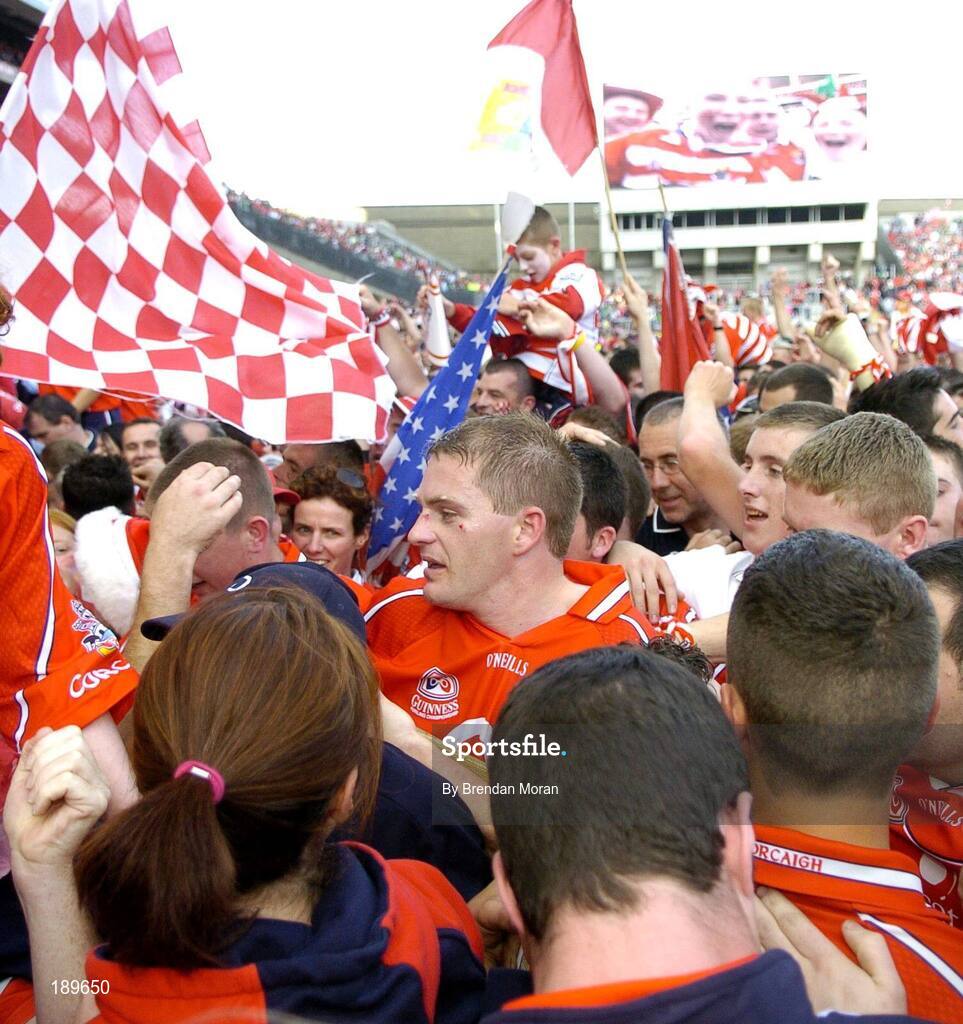 11 September 2005; Cork's Joe Deane, centre, is surrounded by fans after the game. Guinness All-Ireland Senior Hurling Championship Final, Galway v Cork, Croke Park, Dublin. Picture credit; Brendan Moran / SPORTSFILE *** Local Caption *** Any photograph taken by SPORTSFILE during, or in connection with, the 2005 Guinness All-Ireland Hurling Final which displays GAA logos or contains an image or part of an image of any GAA intellectual property, or, which contains images of a GAA player/players in their playing uniforms, may only be used for editorial and non-advertising purposes.  Use of photographs for advertising, as posters or for purchase separately is strictly prohibited unless prior written approval has been obtained from the Gaelic Athletic Association.