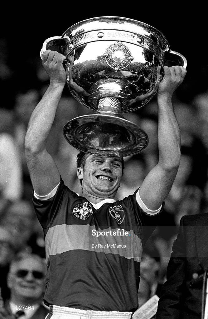 22 September 1985; Kerry captain Páidí Ó Sé lifts the Sam Maguire Cup after the All Ireland Football Championship Final match between Kerry and Dublin at Croke Park, Dublin. Photo by Ray McManus/Sportsfile