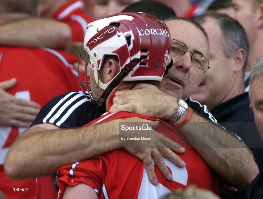 11 September 2005; Cork manager John Allen celebrates with Ronan Curran after the game. Guinness All-Ireland Senior Hurling Championship Final, Galway v Cork, Croke Park, Dublin. Picture credit; Brendan Moran / SPORTSFILE *** Local Caption *** Any photograph taken by SPORTSFILE during, or in connection with, the 2005 Guinness All-Ireland Hurling Final which displays GAA logos or contains an image or part of an image of any GAA intellectual property, or, which contains images of a GAA player/players in their playing uniforms, may only be used for editorial and non-advertising purposes.  Use of photographs for advertising, as posters or for purchase separately is strictly prohibited unless prior written approval has been obtained from the Gaelic Athletic Association.