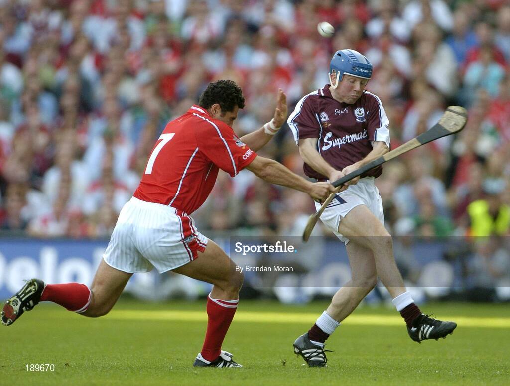 11 September 2005; Sean Og O hAilpin, Cork, attempts to block a shot by Kevin Broderick, Galway. Guinness All-Ireland Senior Hurling Championship Final, Galway v Cork, Croke Park, Dublin. Picture credit; Brendan Moran / SPORTSFILE *** Local Caption *** Any photograph taken by SPORTSFILE during, or in connection with, the 2005 Guinness All-Ireland Hurling Final which displays GAA logos or contains an image or part of an image of any GAA intellectual property, or, which contains images of a GAA player/players in their playing uniforms, may only be used for editorial and non-advertising purposes.  Use of photographs for advertising, as posters or for purchase separately is strictly prohibited unless prior written approval has been obtained from the Gaelic Athletic Association.