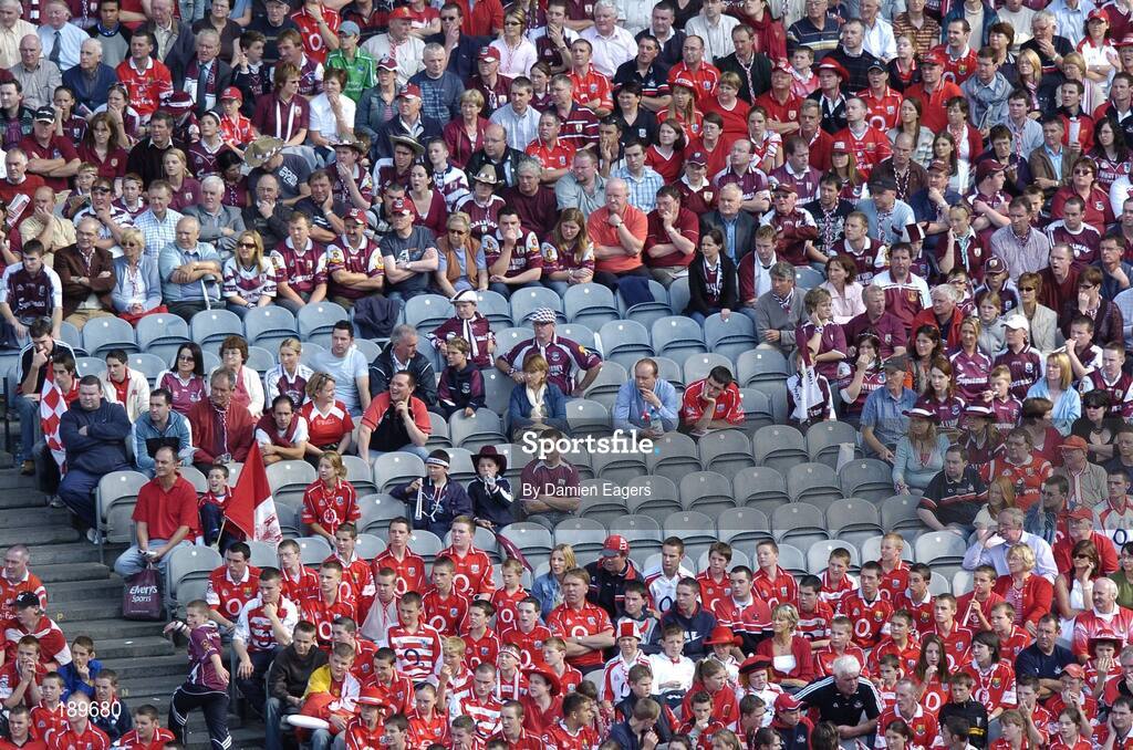 11 September 2005; Galway and Cork supporters watch the match in the Lower Cusack Stand. Guinness All-Ireland Senior Hurling Championship Final, Galway v Cork, Croke Park, Dublin. Picture credit; Damien Eagers / SPORTSFILE *** Local Caption *** Any photograph taken by SPORTSFILE during, or in connection with, the 2005 Guinness All-Ireland Hurling Final which displays GAA logos or contains an image or part of an image of any GAA intellectual property, or, which contains images of a GAA player/players in their playing uniforms, may only be used for editorial and non-advertising purposes.  Use of photographs for advertising, as posters or for purchase separately is strictly prohibited unless prior written approval has been obtained from the Gaelic Athletic Association.
