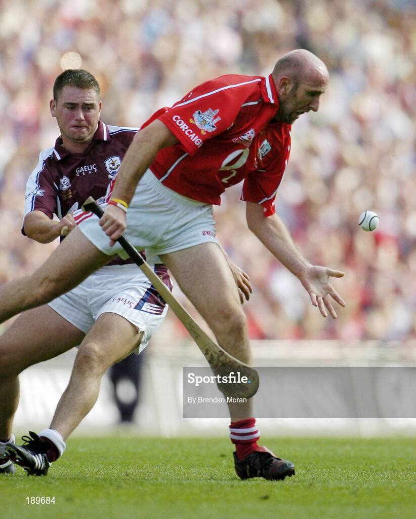 11 September 2005; Brian Corcoran, Cork, in action against Derick Hardiman, Galway. Guinness All-Ireland Senior Hurling Championship Final, Galway v Cork, Croke Park, Dublin. Picture credit; Brendan Moran / SPORTSFILE *** Local Caption *** Any photograph taken by SPORTSFILE during, or in connection with, the 2005 Guinness All-Ireland Hurling Final which displays GAA logos or contains an image or part of an image of any GAA intellectual property, or, which contains images of a GAA player/players in their playing uniforms, may only be used for editorial and non-advertising purposes.  Use of photographs for advertising, as posters or for purchase separately is strictly prohibited unless prior written approval has been obtained from the Gaelic Athletic Association.