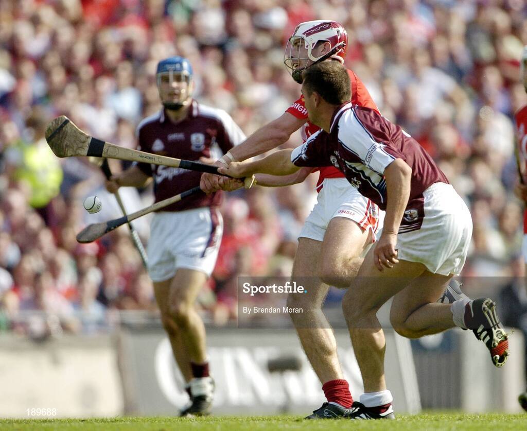 11 September 2005; Ronan Curran, Cork, in action against Derick Hardiman, Galway. Guinness All-Ireland Senior Hurling Championship Final, Galway v Cork, Croke Park, Dublin. Picture credit; Brendan Moran / SPORTSFILE *** Local Caption *** Any photograph taken by SPORTSFILE during, or in connection with, the 2005 Guinness All-Ireland Hurling Final which displays GAA logos or contains an image or part of an image of any GAA intellectual property, or, which contains images of a GAA player/players in their playing uniforms, may only be used for editorial and non-advertising purposes.  Use of photographs for advertising, as posters or for purchase separately is strictly prohibited unless prior written approval has been obtained from the Gaelic Athletic Association.