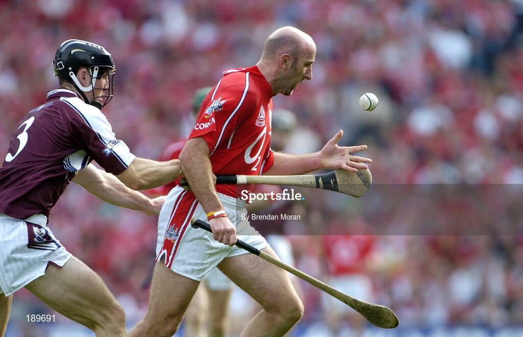 11 September 2005; Brian Corcoran, Cork, in action against Tony Og Regan, Galway. Guinness All-Ireland Senior Hurling Championship Final, Galway v Cork, Croke Park, Dublin. Picture credit; Brendan Moran / SPORTSFILE *** Local Caption *** Any photograph taken by SPORTSFILE during, or in connection with, the 2005 Guinness All-Ireland Hurling Final which displays GAA logos or contains an image or part of an image of any GAA intellectual property, or, which contains images of a GAA player/players in their playing uniforms, may only be used for editorial and non-advertising purposes.  Use of photographs for advertising, as posters or for purchase separately is strictly prohibited unless prior written approval has been obtained from the Gaelic Athletic Association.