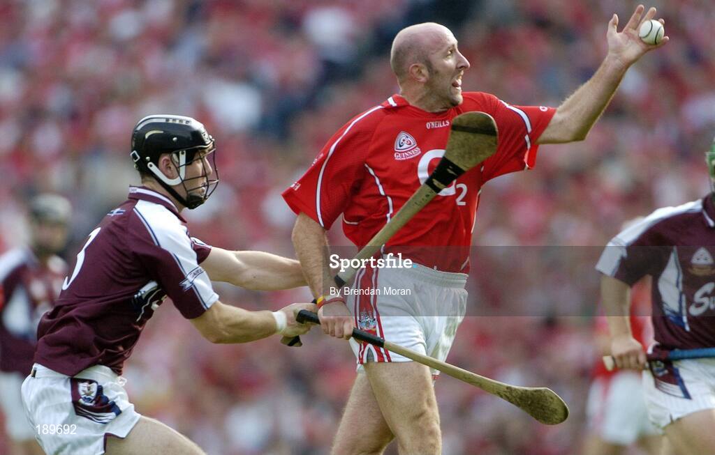 11 September 2005; Brian Corcoran, Cork, in action against Tony Og Regan, Galway. Guinness All-Ireland Senior Hurling Championship Final, Galway v Cork, Croke Park, Dublin. Picture credit; Brendan Moran / SPORTSFILE *** Local Caption *** Any photograph taken by SPORTSFILE during, or in connection with, the 2005 Guinness All-Ireland Hurling Final which displays GAA logos or contains an image or part of an image of any GAA intellectual property, or, which contains images of a GAA player/players in their playing uniforms, may only be used for editorial and non-advertising purposes.  Use of photographs for advertising, as posters or for purchase separately is strictly prohibited unless prior written approval has been obtained from the Gaelic Athletic Association.