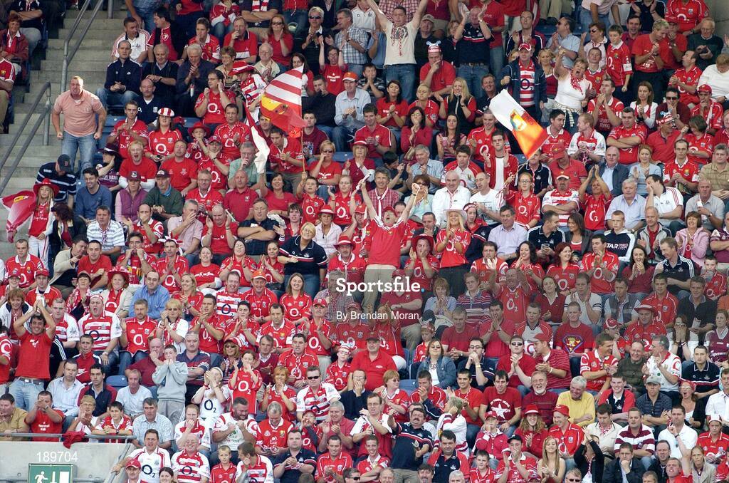 11 September 2005; Cork fans cheer on their side. Guinness All-Ireland Senior Hurling Championship Final, Galway v Cork, Croke Park, Dublin. Picture credit; Brendan Moran / SPORTSFILE *** Local Caption *** Any photograph taken by SPORTSFILE during, or in connection with, the 2005 Guinness All-Ireland Hurling Final which displays GAA logos or contains an image or part of an image of any GAA intellectual property, or, which contains images of a GAA player/players in their playing uniforms, may only be used for editorial and non-advertising purposes.  Use of photographs for advertising, as posters or for purchase separately is strictly prohibited unless prior written approval has been obtained from the Gaelic Athletic Association.