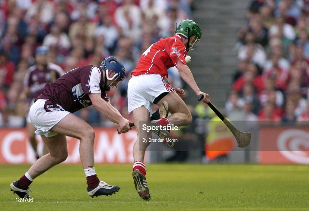 11 September 2005; David Forde, Galway, pulls across the legs of Brian Murphy, Cork, resulting in a free for Cork. Guinness All-Ireland Senior Hurling Championship Final, Galway v Cork, Croke Park, Dublin. Picture credit; Brendan Moran / SPORTSFILE *** Local Caption *** Any photograph taken by SPORTSFILE during, or in connection with, the 2005 Guinness All-Ireland Hurling Final which displays GAA logos or contains an image or part of an image of any GAA intellectual property, or, which contains images of a GAA player/players in their playing uniforms, may only be used for editorial and non-advertising purposes.  Use of photographs for advertising, as posters or for purchase separately is strictly prohibited unless prior written approval has been obtained from the Gaelic Athletic Association.
