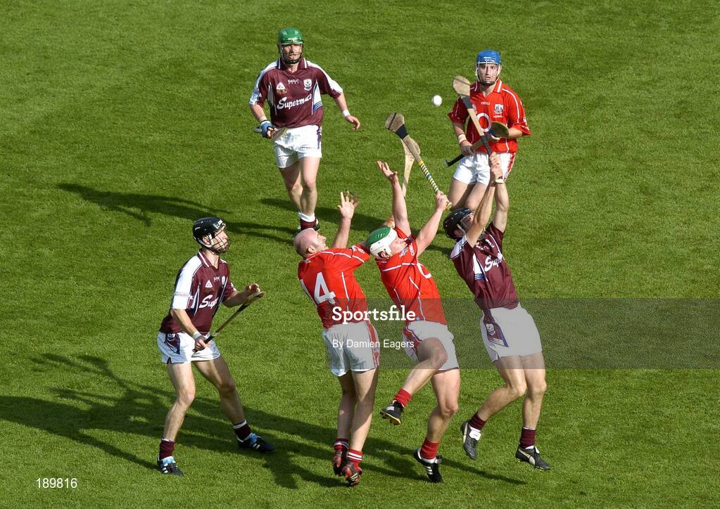 11 September 2005; Cork pair Brian Corcoran, 14, and Niall McCarthy contest a dropping ball with Shane Kavanagh, right and Tony Og Regan. Ollie Canning, Galway, and Kieran Murphy, Cork, await the breaking ball. Guinness All-Ireland Senior Hurling Championship Final, Galway v Cork, Croke Park, Dublin. Picture credit; Damien Eagers / SPORTSFILE *** Local Caption *** Any photograph taken by SPORTSFILE during, or in connection with, the 2005 Guinness All-Ireland Hurling Final which displays GAA logos or contains an image or part of an image of any GAA intellectual property, or, which contains images of a GAA player/players in their playing uniforms, may only be used for editorial and non-advertising purposes.  Use of photographs for advertising, as posters or for purchase separately is strictly prohibited unless prior written approval has been obtained from the Gaelic Athletic Association.