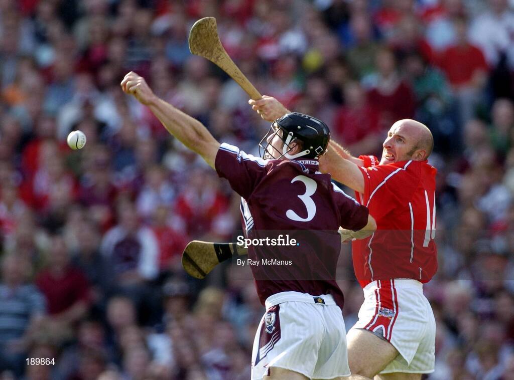 11 September 2005; Tony Og Regan, Galway, in action against Brian Corcoran, Cork. Guinness All-Ireland Senior Hurling Championship Final, Galway v Cork, Croke Park, Dublin. Picture credit; Ray McManus / SPORTSFILE *** Local Caption *** Any photograph taken by SPORTSFILE during, or in connection with, the 2005 Guinness All-Ireland Hurling Final which displays GAA logos or contains an image or part of an image of any GAA intellectual property, or, which contains images of a GAA player/players in their playing uniforms, may only be used for editorial and non-advertising purposes.  Use of photographs for advertising, as posters or for purchase separately is strictly prohibited unless prior written approval has been obtained from the Gaelic Athletic Association.
