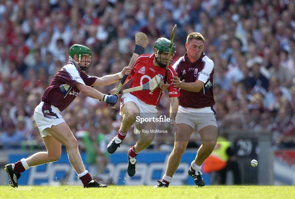 11 September 2005; Jerry O'Connor, Cork, in action against Ollie Canning, left, and Derick Hardiman, right, Galway. Guinness All-Ireland Senior Hurling Championship Final, Galway v Cork, Croke Park, Dublin. Picture credit; Ray McManus / SPORTSFILE *** Local Caption *** Any photograph taken by SPORTSFILE during, or in connection with, the 2005 Guinness All-Ireland Hurling Final which displays GAA logos or contains an image or part of an image of any GAA intellectual property, or, which contains images of a GAA player/players in their playing uniforms, may only be used for editorial and non-advertising purposes.  Use of photographs for advertising, as posters or for purchase separately is strictly prohibited unless prior written approval has been obtained from the Gaelic Athletic Association.