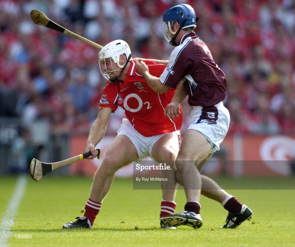 11 September 2005; Timmy McCarthy, Cork, in action against David Collins, Galway. Guinness All-Ireland Senior Hurling Championship Final, Galway v Cork, Croke Park, Dublin. Picture credit; Ray McManus / SPORTSFILE *** Local Caption *** Any photograph taken by SPORTSFILE during, or in connection with, the 2005 Guinness All-Ireland Hurling Final which displays GAA logos or contains an image or part of an image of any GAA intellectual property, or, which contains images of a GAA player/players in their playing uniforms, may only be used for editorial and non-advertising purposes.  Use of photographs for advertising, as posters or for purchase separately is strictly prohibited unless prior written approval has been obtained from the Gaelic Athletic Association.