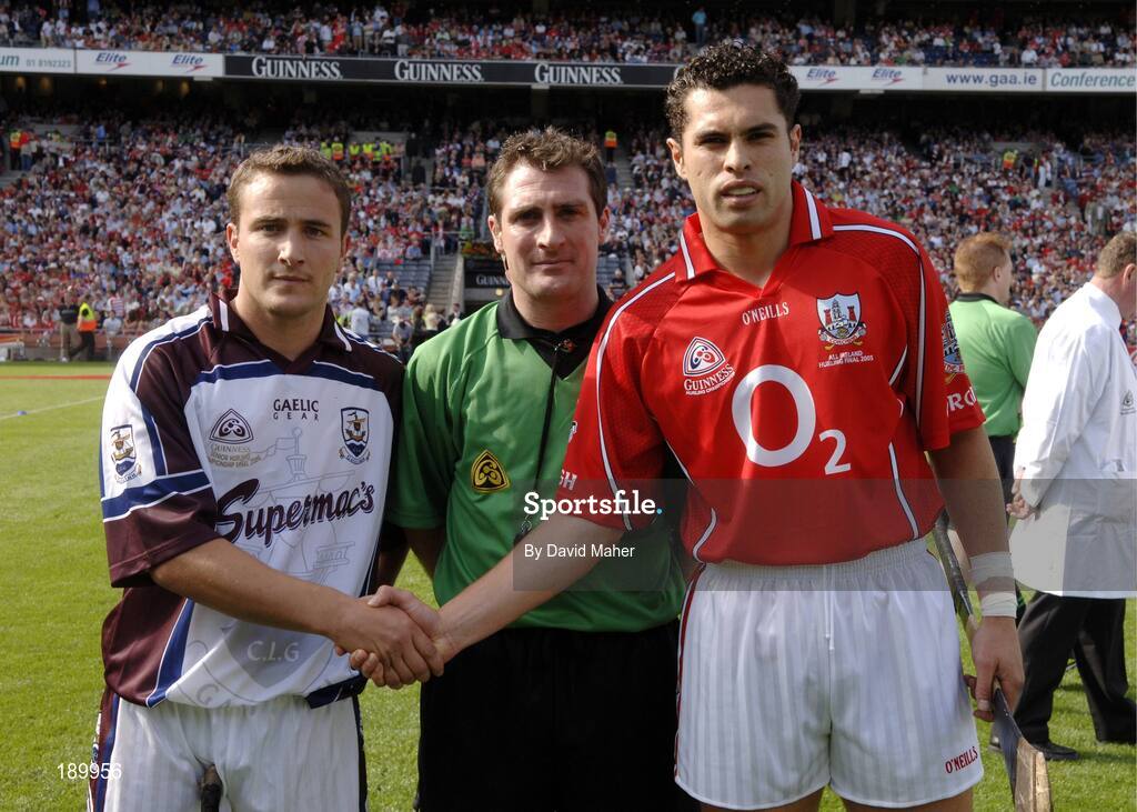 11 September 2005; Referee Seamus Roche with Galway captain Liam Donoghue, left, and Cork captain Sean Og O hAilpin, Cork, right, before the game. Guinness All-Ireland Senior Hurling Championship Final, Galway v Cork, Croke Park, Dublin. Picture credit; David Maher / SPORTSFILE *** Local Caption *** Any photograph taken by SPORTSFILE during, or in connection with, the 2005 Guinness All-Ireland Hurling Final which displays GAA logos or contains an image or part of an image of any GAA intellectual property, or, which contains images of a GAA player/players in their playing uniforms, may only be used for editorial and non-advertising purposes.  Use of photographs for advertising, as posters or for purchase separately is strictly prohibited unless prior written approval has been obtained from the Gaelic Athletic Association.