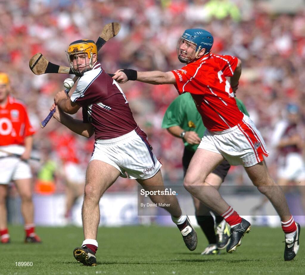 11 September 2005; Ger Farragher, Galway, in action against Pat Mulcahy, Cork. Guinness All-Ireland Senior Hurling Championship Final, Galway v Cork, Croke Park, Dublin. Picture credit; David Maher / SPORTSFILE *** Local Caption *** Any photograph taken by SPORTSFILE during, or in connection with, the 2005 Guinness All-Ireland Hurling Final which displays GAA logos or contains an image or part of an image of any GAA intellectual property, or, which contains images of a GAA player/players in their playing uniforms, may only be used for editorial and non-advertising purposes.  Use of photographs for advertising, as posters or for purchase separately is strictly prohibited unless prior written approval has been obtained from the Gaelic Athletic Association.