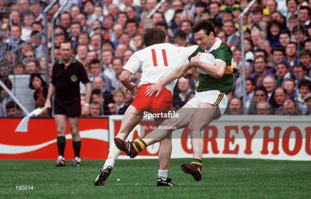 21 September 1986; Tommy Doyle of Kerry is tackled by Eugene McKenna of Tyrone during the All-Ireland Senior Football Championship final between Kerry and Tyrone in Croke Park, Dublin. Photo by Ray McManus/Sportsfile