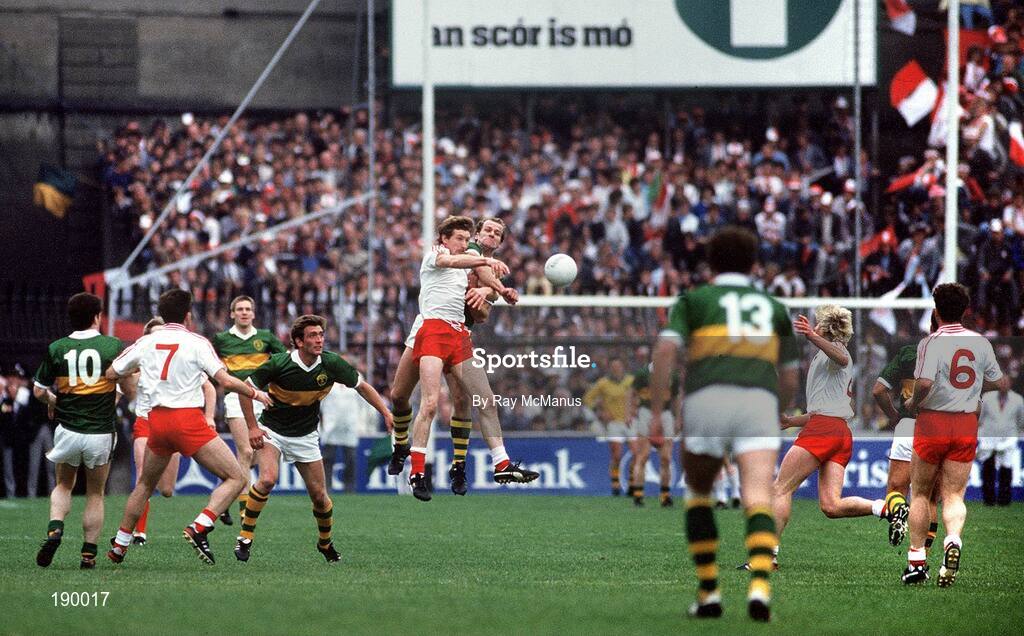 21 September 1986; Jack O'Shea of Kerry contests a high ball with Harry McClure of Tyrone, as Willie Maher of Kerry, left, Paddy Ball of Tyrone, Ambrose O'Donovan of Kerry, John Lynch, second from right, and Noel McGinn of Tyrone, right, await the break during the All-Ireland Senior Football Championship final between Kerry and Tyrone in Croke Park, Dublin. Photo by Ray McManus/Sportsfile