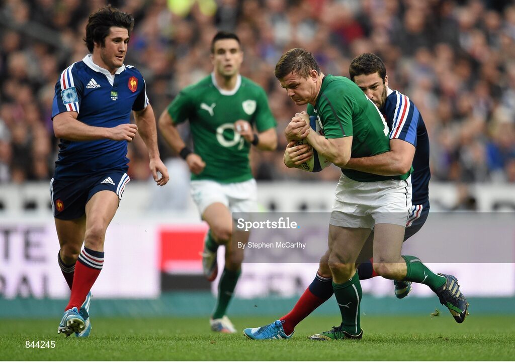 15 March 2014; Brian O'Driscoll, Ireland, is tackled by Remi Tálès, France. RBS Six Nations Rugby Championship 2014, France v Ireland, Stade De France, Saint Denis, Paris, France. Picture credit: Stephen McCarthy / SPORTSFILE