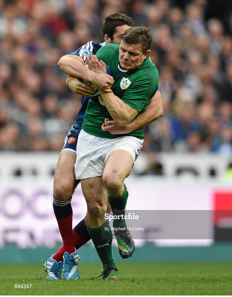 15 March 2014; Brian O'Driscoll, Ireland, is tackled by Remi Tálès, France. RBS Six Nations Rugby Championship 2014, France v Ireland, Stade De France, Saint Denis, Paris, France. Picture credit: Stephen McCarthy / SPORTSFILE