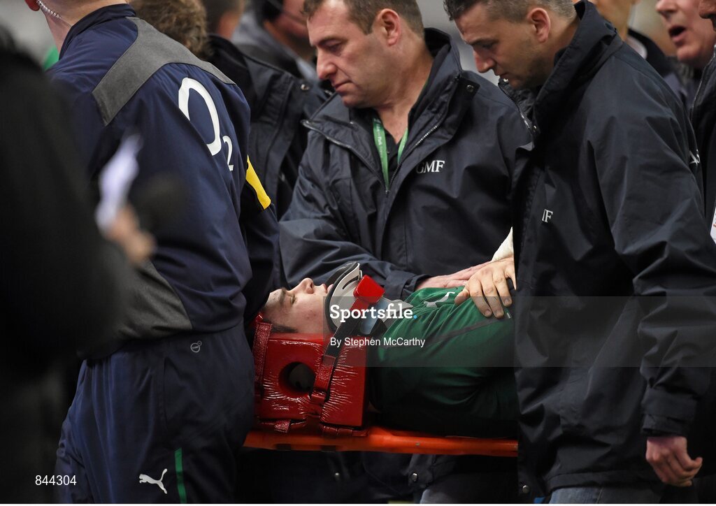 15 March 2014; Ireland's Jonathan Sexton is carried from the field in a head brace following a collision with France's Mathieu Bastareaud during the second half. RBS Six Nations Rugby Championship 2014, France v Ireland, Stade De France, Saint Denis, Paris, France. Picture credit: Stephen McCarthy / SPORTSFILE