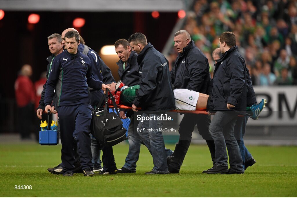 15 March 2014; Ireland's Jonathan Sexton is carried from the field in a head brace following a collision with France's Mathieu Bastareaud during the second half. RBS Six Nations Rugby Championship 2014, France v Ireland, Stade De France, Saint Denis, Paris, France. Picture credit: Stephen McCarthy / SPORTSFILE