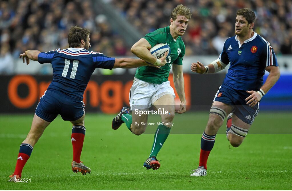 15 March 2014; Andrew Trimble, Ireland, is tackled by Maxime Médard, France. RBS Six Nations Rugby Championship 2014, France v Ireland, Stade De France, Saint Denis, Paris, France. Picture credit: Stephen McCarthy / SPORTSFILE