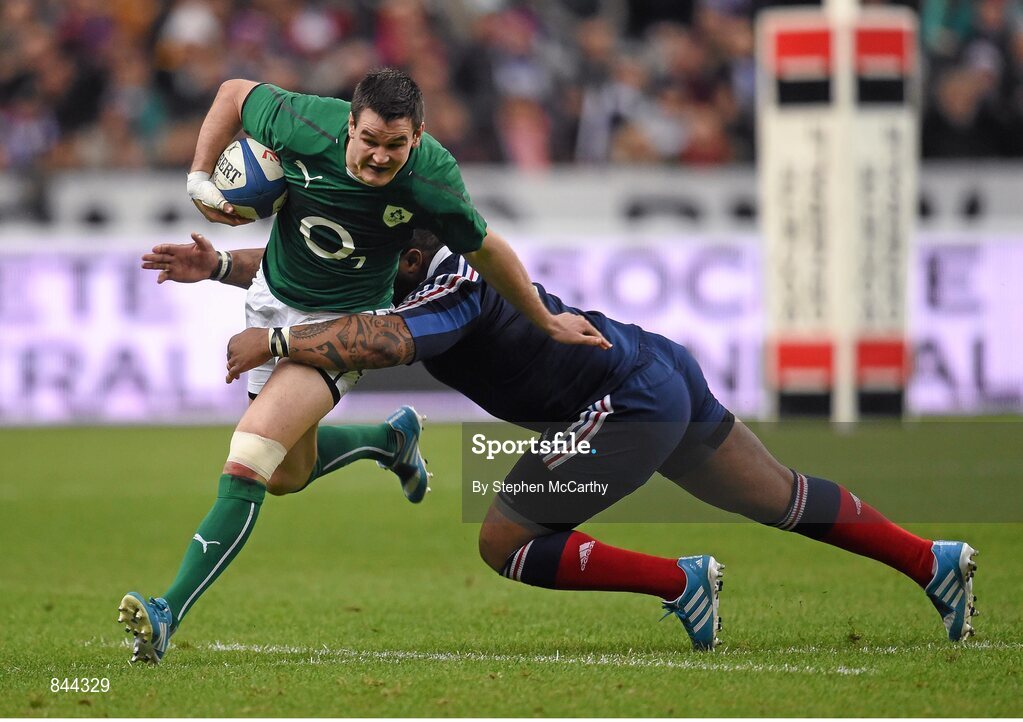 15 March 2014; Jonathan Sexton, Ireland, is tackled by Mathieu Bastareaud, France. RBS Six Nations Rugby Championship 2014, France v Ireland, Stade De France, Saint Denis, Paris, France. Picture credit: Stephen McCarthy / SPORTSFILE