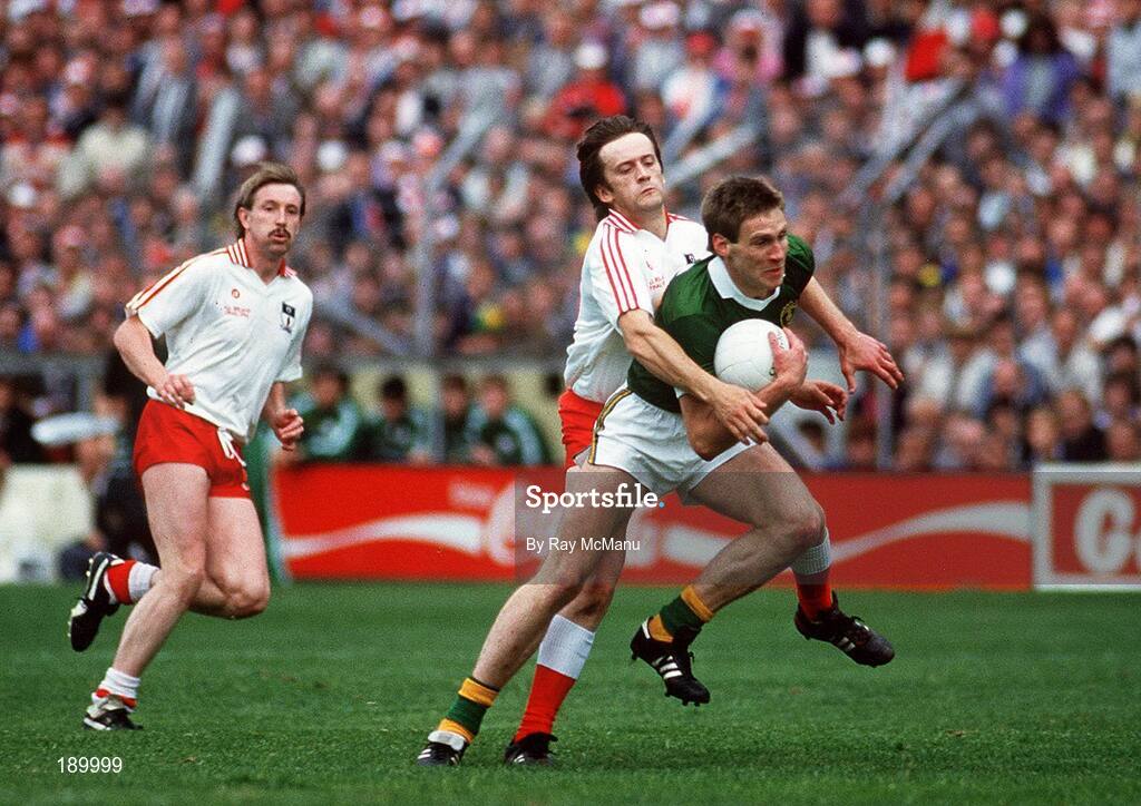 21 September 1986; Tom Spillane of Kerry in action against Paudge Quinn of Tyrone as Damien O'Hagan of Tyrone looks on during the All-Ireland Senior Football Championship final between Kerry and Tyrone in Croke Park, Dublin. Photo by Ray McManus/Sportsfile