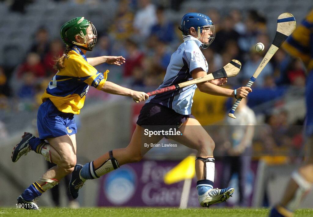 18 September 2005; Ciara Lucey, Dublin, in action against Moira McMahon, Clare. Dublin v Clare, All-Ireland Junior Camogie Final, Croke Park, Dublin. Picture credit; Brian Lawless / SPORTSFILE *** Local Caption *** Any photograph taken by SPORTSFILE during, or in connection with, the 2005 Guinness All-Ireland Hurling Final which displays GAA logos or contains an image or part of an image of any GAA intellectual property, or, which contains images of a GAA player/players in their playing uniforms, may only be used for editorial and non-advertising purposes.  Use of photographs for advertising, as posters or for purchase separately is strictly prohibited unless prior written approval has been obtained from the Gaelic Athletic Association.