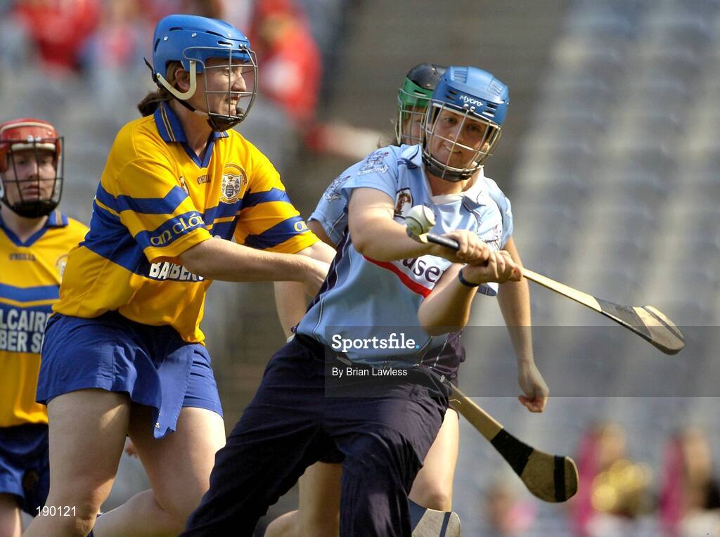 18 September 2005; Eimear Butler, Dublin, in action against Cathy Halley, Clare. Dublin v Clare, All-Ireland Junior Camogie Final, Croke Park, Dublin. Picture credit; Brian Lawless / SPORTSFILE *** Local Caption *** Any photograph taken by SPORTSFILE during, or in connection with, the 2005 Guinness All-Ireland Hurling Final which displays GAA logos or contains an image or part of an image of any GAA intellectual property, or, which contains images of a GAA player/players in their playing uniforms, may only be used for editorial and non-advertising purposes.  Use of photographs for advertising, as posters or for purchase separately is strictly prohibited unless prior written approval has been obtained from the Gaelic Athletic Association.