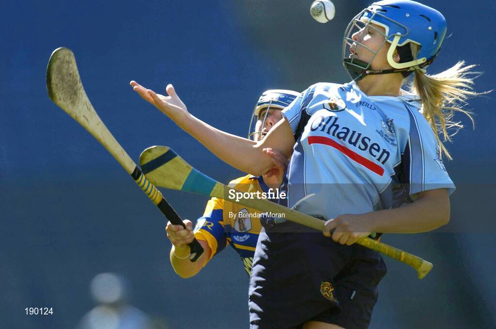 18 September 2005; Aoife Cullen, Dublin, is tackled by Claire McMahon, Clare. Dublin v Clare, All-Ireland Junior Camogie Final, Croke Park, Dublin. Picture credit; Brendan Moran / SPORTSFILE *** Local Caption *** Any photograph taken by SPORTSFILE during, or in connection with, the 2005 Guinness All-Ireland Hurling Final which displays GAA logos or contains an image or part of an image of any GAA intellectual property, or, which contains images of a GAA player/players in their playing uniforms, may only be used for editorial and non-advertising purposes.  Use of photographs for advertising, as posters or for purchase separately is strictly prohibited unless prior written approval has been obtained from the Gaelic Athletic Association.