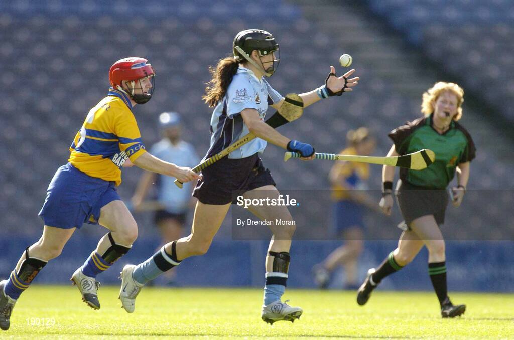 18 September 2005; Louise O'Hara, Dublin, is tackled by Cathy Halley, Clare. Dublin v Clare, All-Ireland Junior Camogie Final, Croke Park, Dublin. Picture credit; Brendan Moran / SPORTSFILE *** Local Caption *** Any photograph taken by SPORTSFILE during, or in connection with, the 2005 Guinness All-Ireland Hurling Final which displays GAA logos or contains an image or part of an image of any GAA intellectual property, or, which contains images of a GAA player/players in their playing uniforms, may only be used for editorial and non-advertising purposes.  Use of photographs for advertising, as posters or for purchase separately is strictly prohibited unless prior written approval has been obtained from the Gaelic Athletic Association.